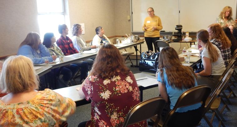 Lara Sjogren teaching a full classroom of sisters