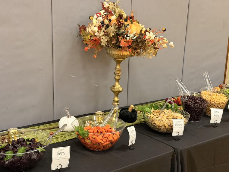 The luncheon table of roasted vegetables, grains, and toppings